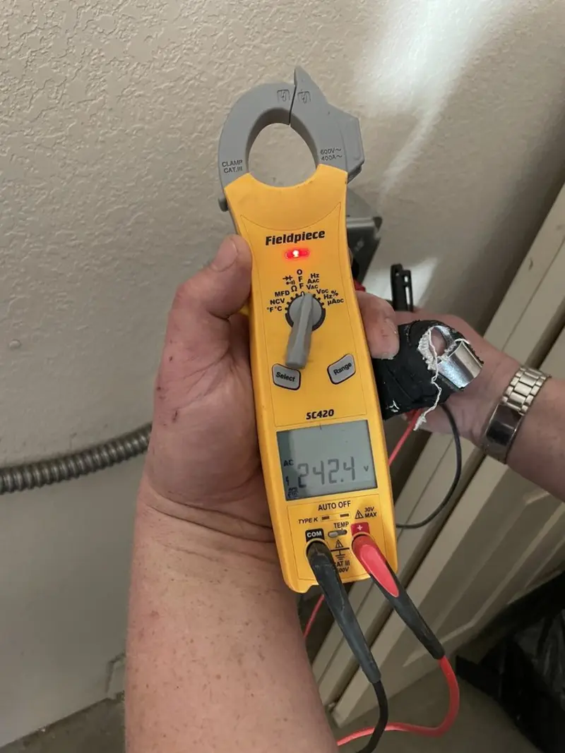Voltage testing with clamp meter during Whole House Surge Protector in Oconto